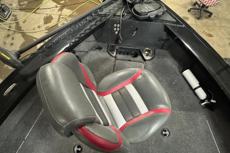 Slide: The Image of 2023 Ranger VX1888 WT boat with Minn Kota trolling motor in a workshop setting. - 18