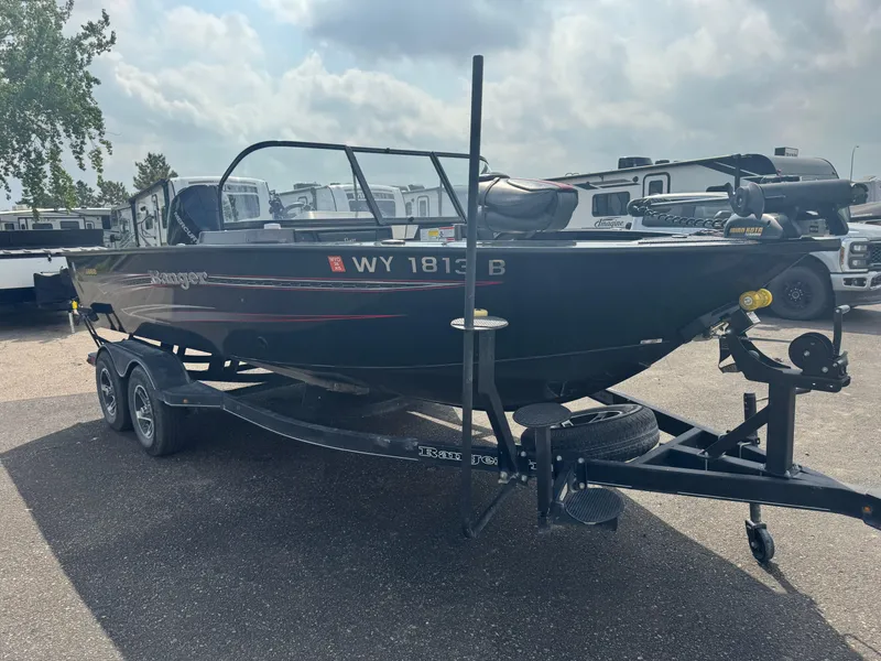 Slide: The Image of 2023 Ranger VX1888 WT boat on trailer in a garage setting. - 2