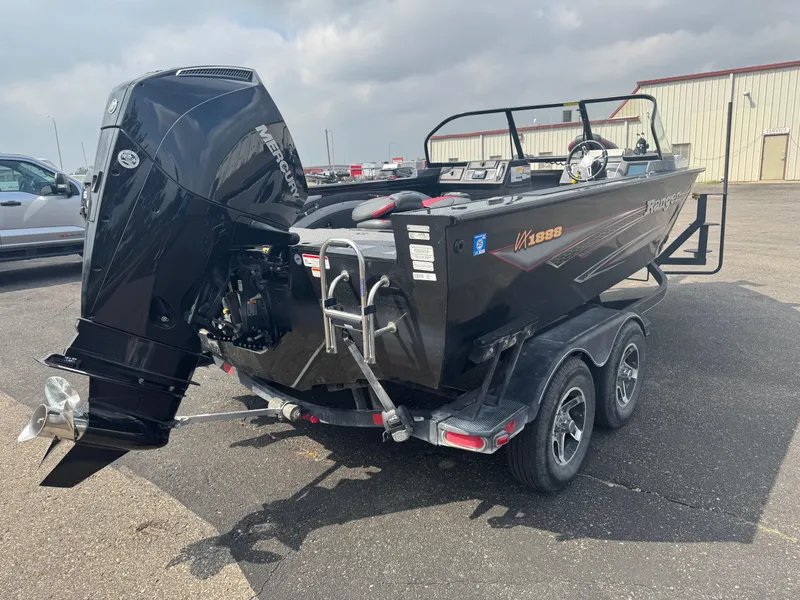 Slide: The Image of 2023 Ranger VX1888 WT boat with Mercury engine in a garage setting. - 3