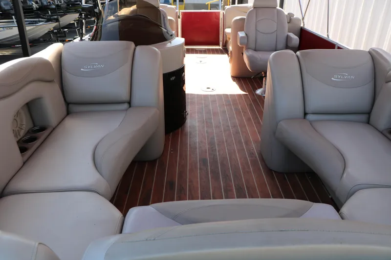 Slide: The Image of 2013 Sylvan Mirage 8522 pontoon boat with red exterior on a trailer. - 10