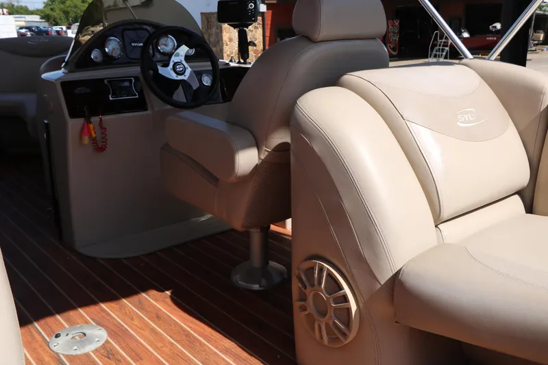 Slide: The Image of Beige seating on 2013 Sylvan Mirage 8522 boat with wooden flooring and built-in speakers. - 24