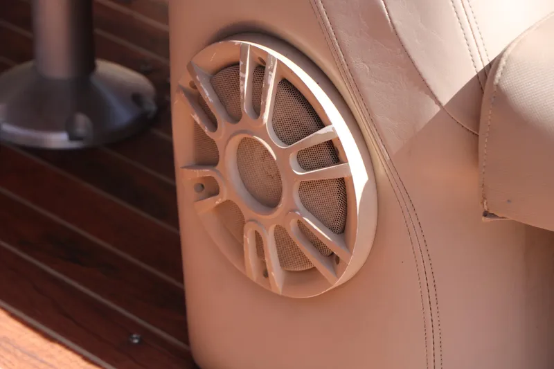 Slide: The Image of Speaker and cup holders on 2013 Sylvan Mirage 8522 boat interior. - 25