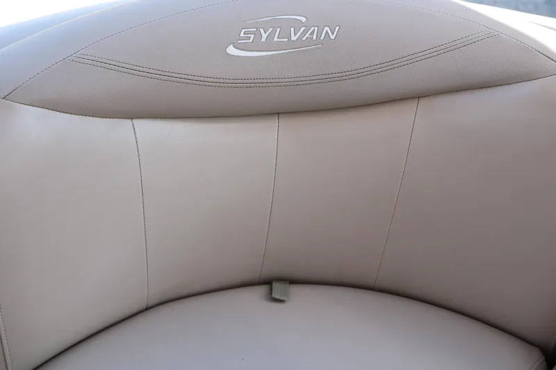 Slide: The Image of 2013 Sylvan Mirage 8522 boat dashboard with steering wheel and gauges. - 28