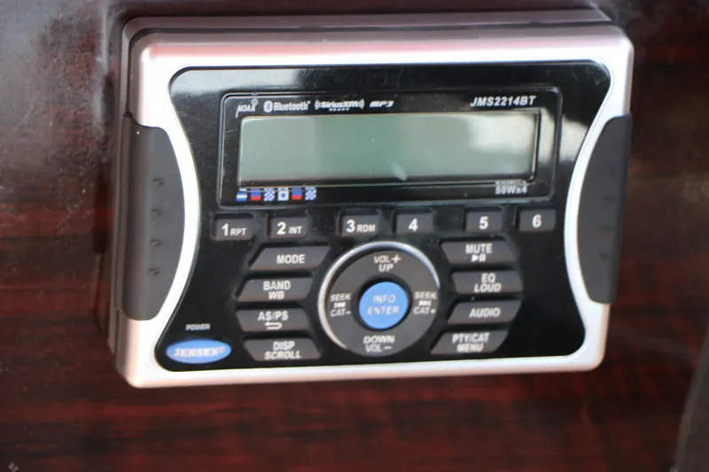 Slide: The Image of 2013 Sylvan Mirage 8522 boat seat with logo, beige upholstery. - 30