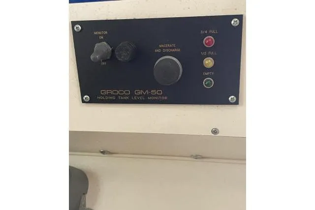 Slide: The Image of Grady-White Journey 258 (1997) holding tank level monitor panel with indicator lights. - 20