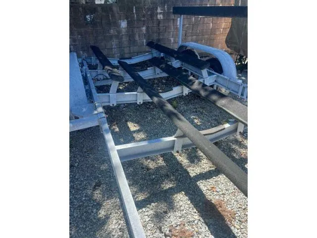 Slide: The Image of Boat trailer for 1997 Grady-White 258 Journey on gravel surface. - 26