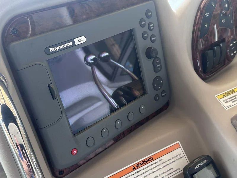 Slide: The Image of Raymarine C80 navigation system on 2007 Sea Ray 320 Sundancer boat dashboard. - 20