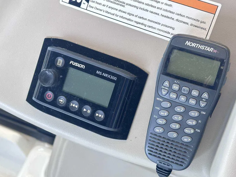 Slide: The Image of Fusion MS-NRX300 and Northstar radio on 2007 Sea Ray 320 Sundancer dashboard. - 21
