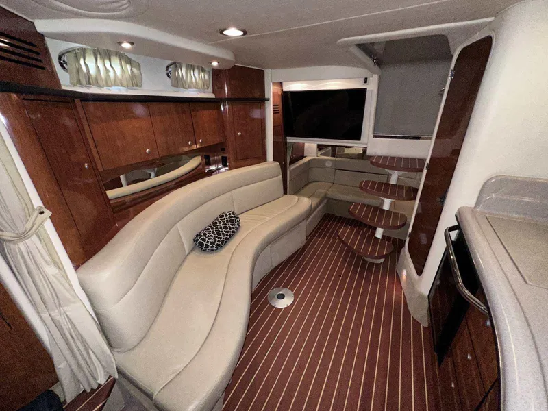 Slide: The Image of Luxurious interior of 2007 Sea Ray 320 Sundancer with elegant seating and wood finishes. - 29