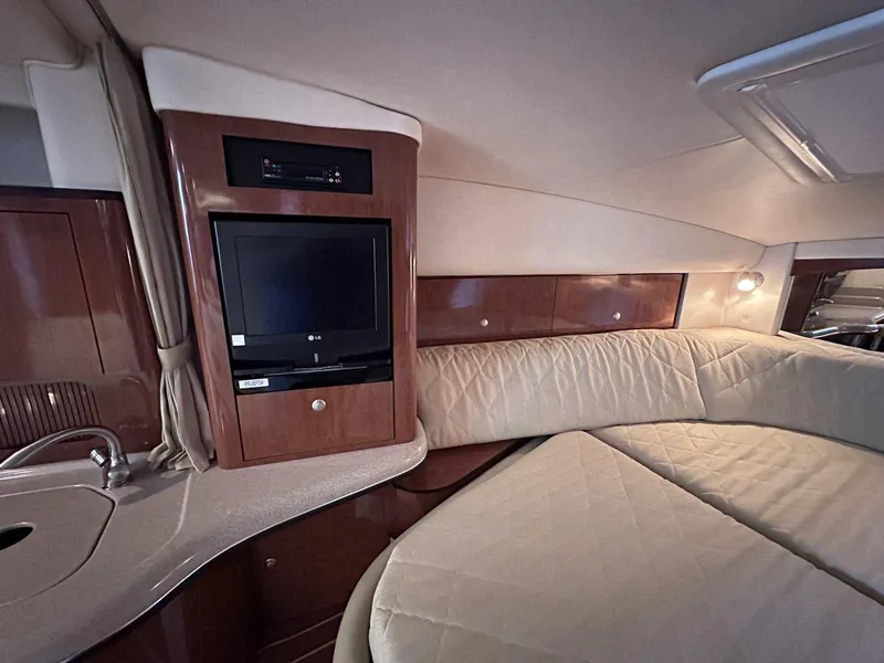 Slide: The Image of Interior of 2007 Sea Ray 320 Sundancer with TV, bed, and kitchenette. - 33