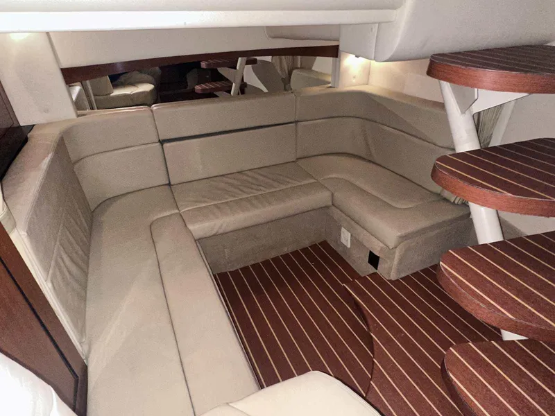 Slide: The Image of Luxurious interior of 2007 Sea Ray 320 Sundancer with plush seating and wooden steps. - 37