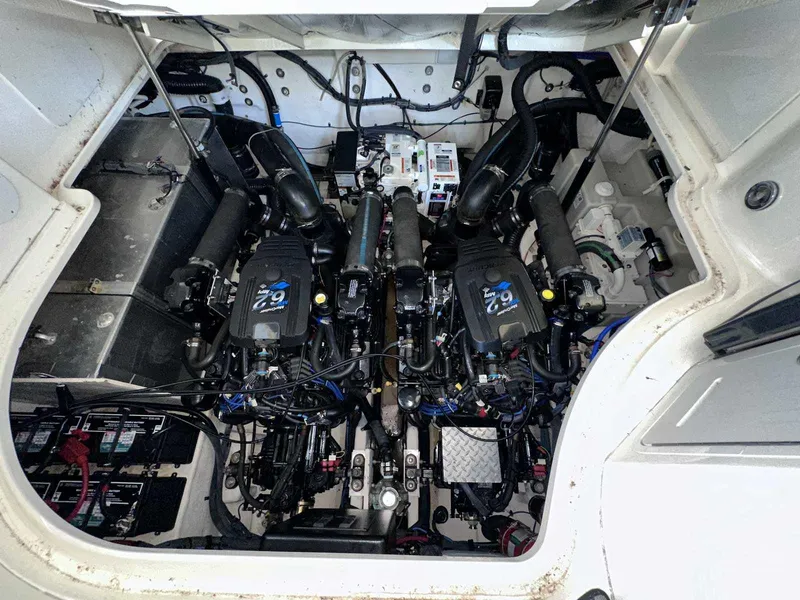 Slide: The Image of Engine compartment of a 2007 Sea Ray 320 Sundancer, showcasing dual engines and wiring. - 41
