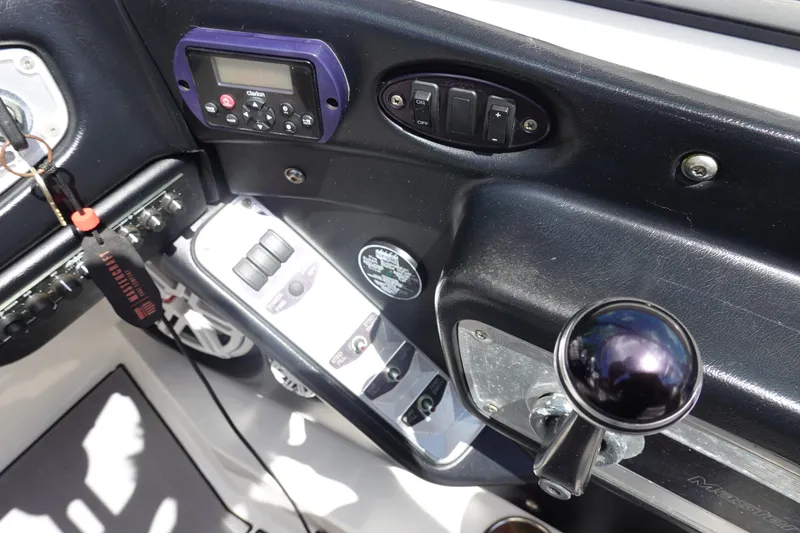 Slide: The Image of Control panel of a 2011 MasterCraft X15 boat with various switches and controls. - 15