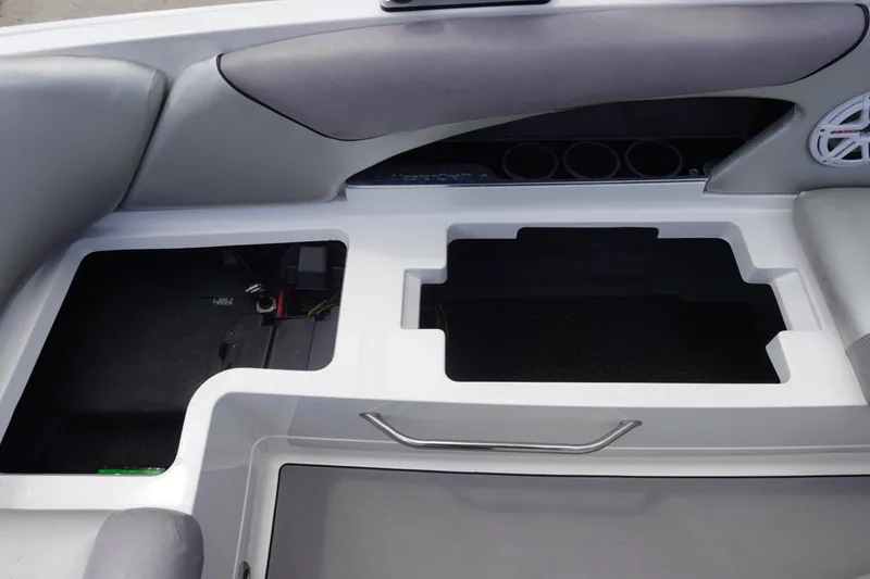 Slide: The Image of 2011 MasterCraft X15 boat interior storage compartments and seating area. - 17