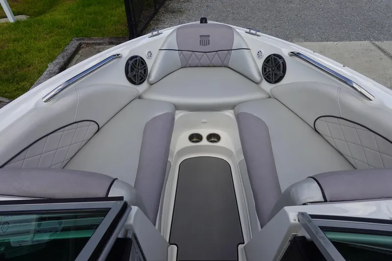 Slide: The Image of 2011 MasterCraft X15 boat interior with gray seating and built-in speakers. - 21