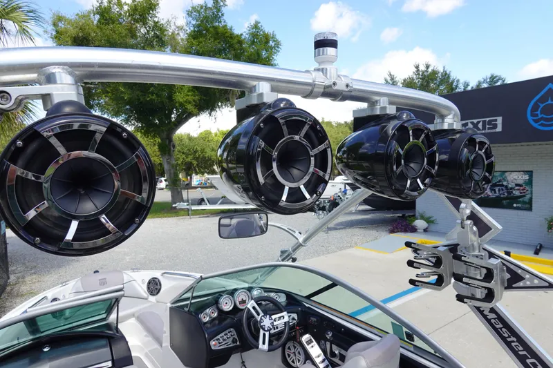 Slide: The Image of 2011 MasterCraft X15 boat with mounted speakers and sleek dashboard. - 27