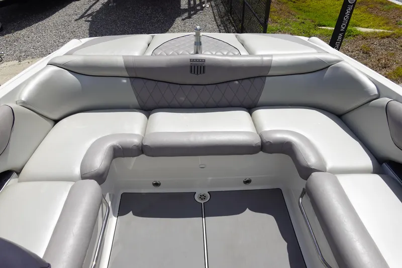 Slide: The Image of 2011 MasterCraft X15 boat interior with gray cushioned seating. - 9