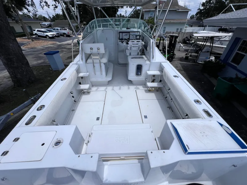 Slide: The Image of 1999 Glacier Bay 2670 Island Runner boat with spacious deck and seating area. - 12