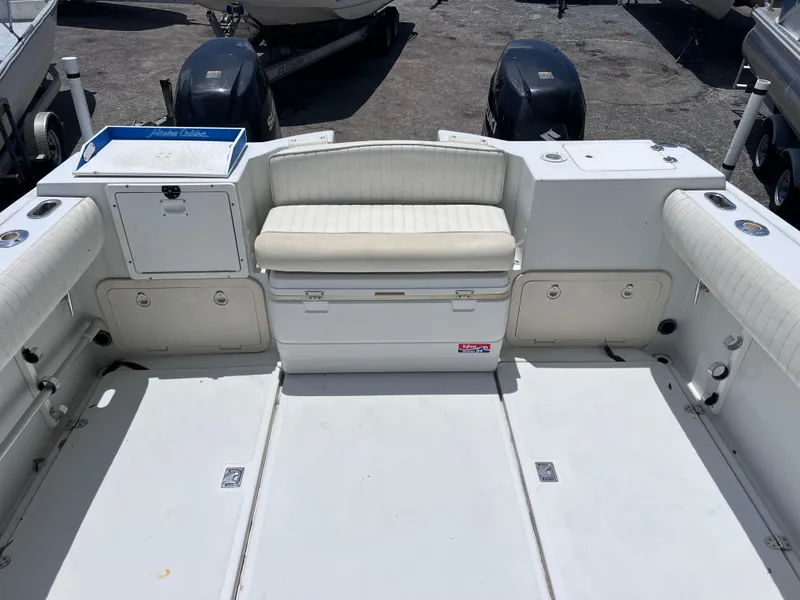 Slide: The Image of 1999 Glacier Bay 2670 Island Runner boat interior with seating and storage compartments. - 13
