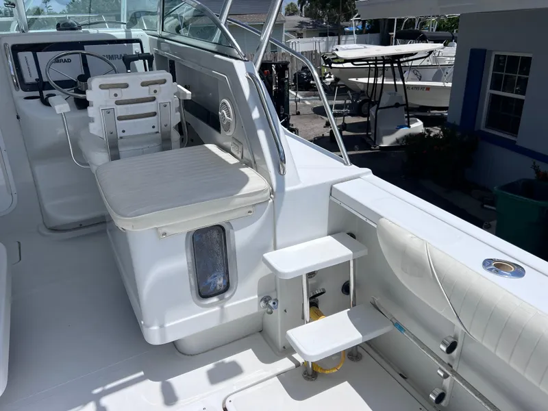 Slide: The Image of 1999 Glacier Bay 2670 Island Runner boat interior with helm and seating area. - 17