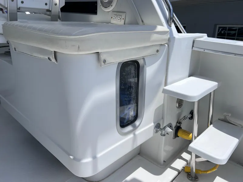 Slide: The Image of 1999 Glacier Bay 2670 Island Runner boat interior with seating and steps. - 22