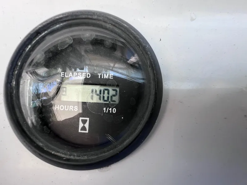 Slide: The Image of Hour meter showing 1402 hours on 1999 Glacier Bay 2670 Island Runner. - 31