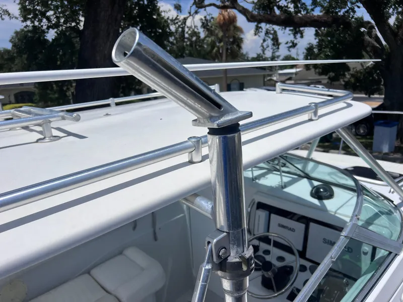 Slide: The Image of 1999 Glacier Bay 2670 Island Runner boat with rod holder and steering console. - 32