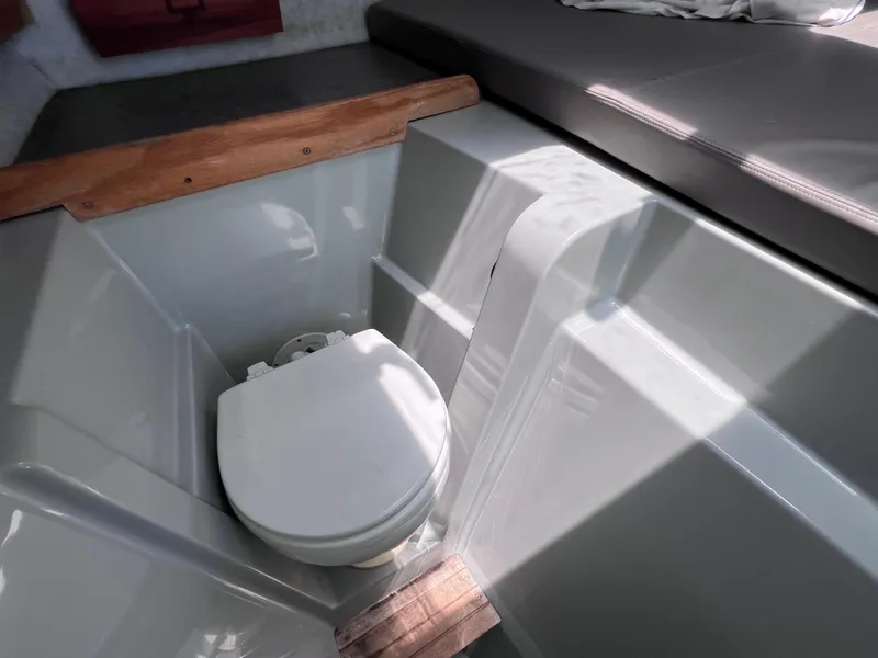 Slide: The Image of 1999 Glacier Bay 2670 Island Runner boat interior with compact toilet. - 39