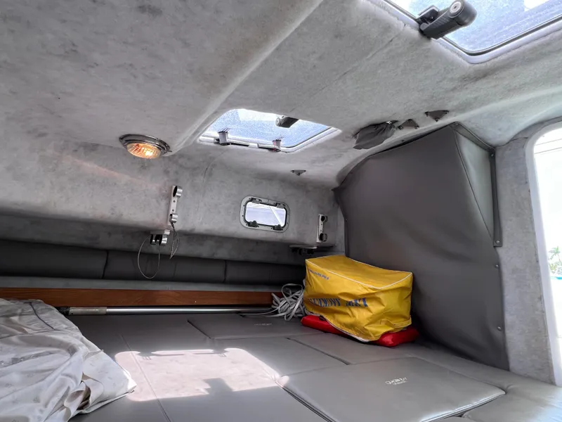 Slide: The Image of Interior cabin of 1999 Glacier Bay 2670 Island Runner boat, featuring seating and storage. - 40