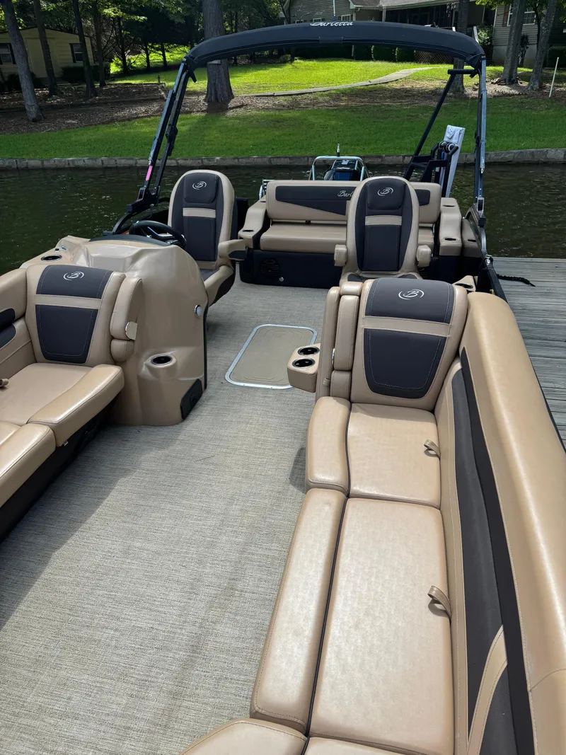 Slide: The Image of 2022 Barletta C24UC pontoon boat with luxurious seating and spacious interior. - 4
