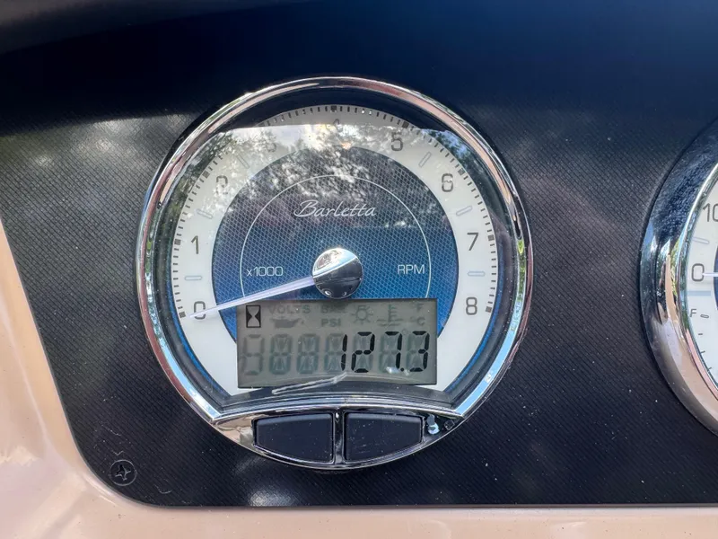 Slide: The Image of Close-up of 2022 Barletta C24UC boat tachometer displaying RPM and digital readings. - 7