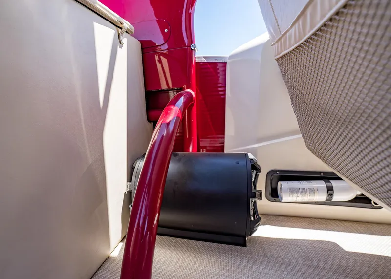 Slide: The Image of Interior view of a 2015 Bennington Q28 boat, featuring seating and safety equipment. - 14