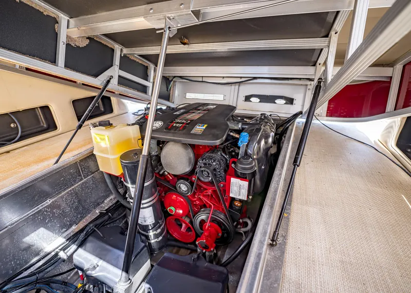 Slide: The Image of 2015 Bennington Q28 engine compartment showcasing detailed mechanical components. - 18