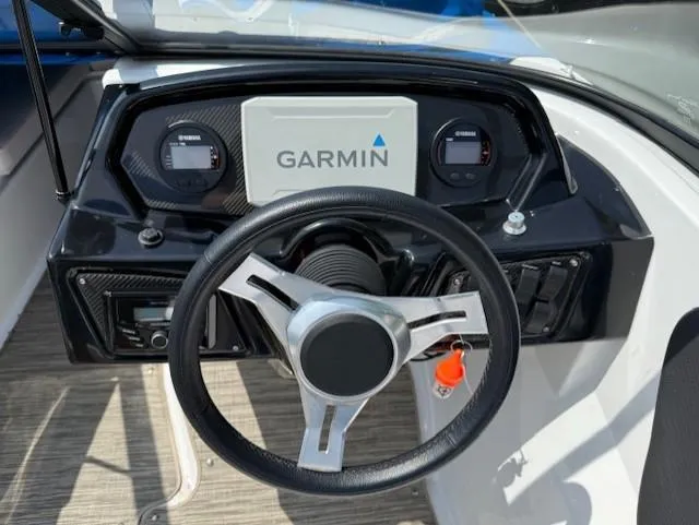 Slide: The Image of Steering wheel and dashboard of 2021 Glastron GX 210 Sport boat with Garmin display. - 6
