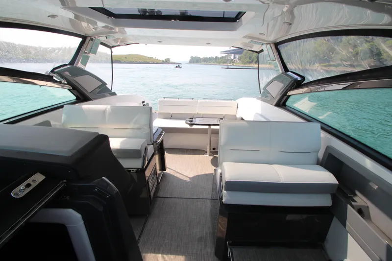 Slide: The Image of Interior of 2018 Cobalt A36 boat with luxurious seating and scenic water view. - 11