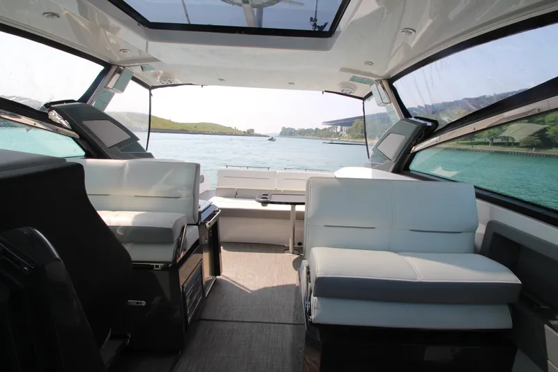 Slide: The Image of Interior of 2018 Cobalt A36 boat with spacious seating and scenic water view. - 12