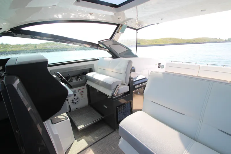 Slide: The Image of Interior of 2018 Cobalt A36 boat with luxurious seating and scenic water view. - 13