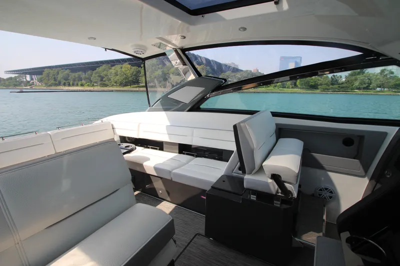 Slide: The Image of Interior of 2018 Cobalt A36 boat with luxurious seating and scenic water view. - 16