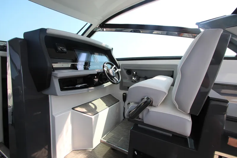 Slide: The Image of Interior helm of 2018 Cobalt A36 boat with modern steering and controls. - 20