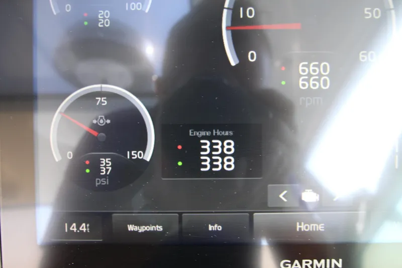 Slide: The Image of Dashboard display of a 2018 Cobalt A36 showing engine hours and gauges. - 21