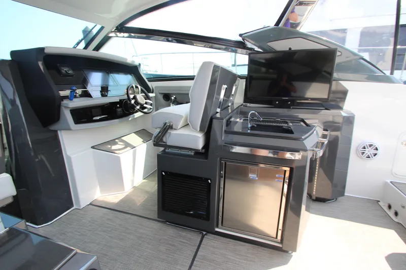 Slide: The Image of Interior of 2018 Cobalt A36 boat with helm, seating, and entertainment area. - 27