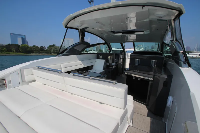Slide: The Image of 2018 Cobalt A36 yacht interior with white seating and modern design. - 29
