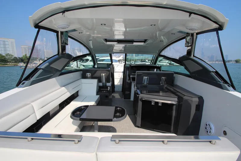 Slide: The Image of Luxurious 2018 Cobalt A36 boat interior with seating and amenities, docked by the waterfront. - 30