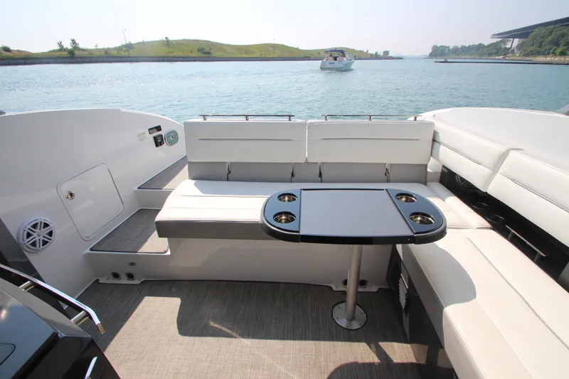 Slide: The Image of Luxurious seating area on a 2018 Cobalt A36 boat with scenic water view. - 38