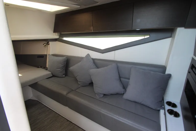 Slide: The Image of Interior of 2018 Cobalt A36 boat with gray seating and cushions. - 41