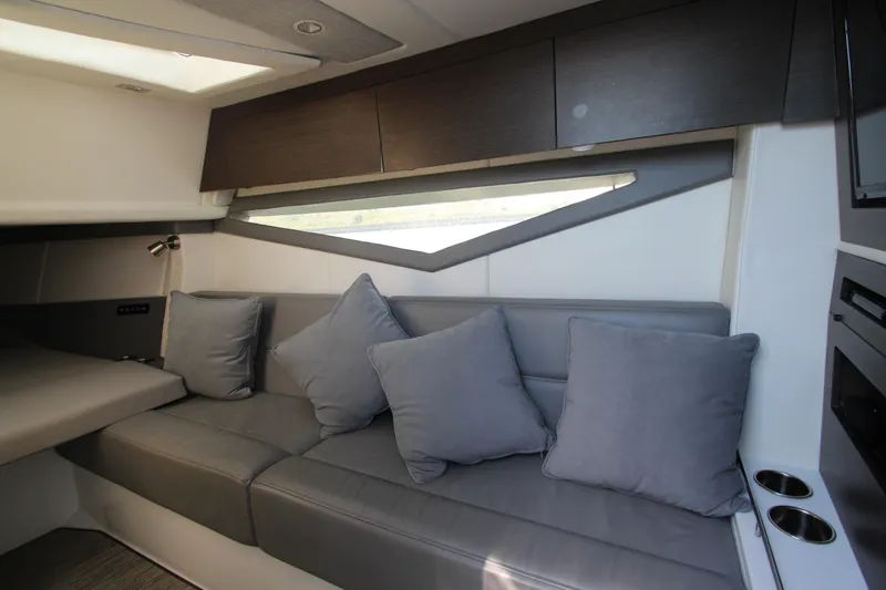 Slide: The Image of Interior of 2018 Cobalt A36 boat with modern gray seating and cushions. - 42