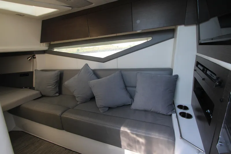 Slide: The Image of Interior of 2018 Cobalt A36 boat with gray seating and modern design. - 43
