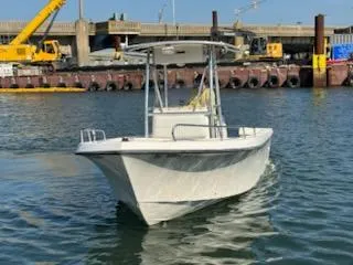 The Image of 2007 May-Craft 2000 boat on water near industrial dock. - 1