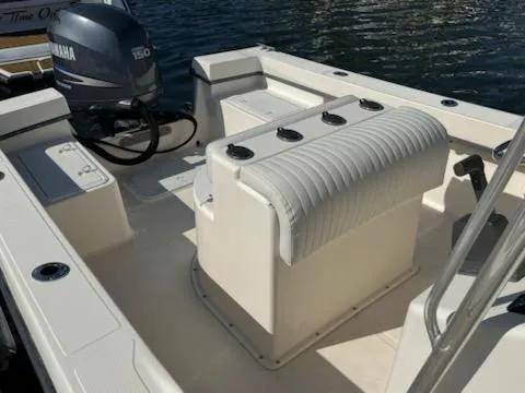 Slide: The Image of 2007 May-Craft 2000 boat interior with Yamaha 150 engine, docked on water. - 8