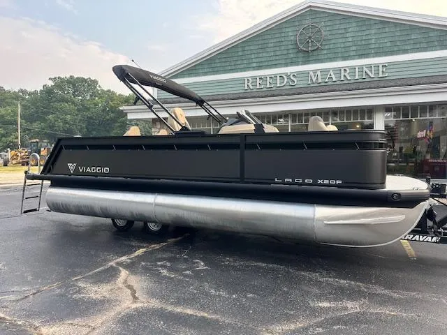 The Image of 2025 Viaggio Lago X-F pontoon boat parked at Reed's Marine dealership. - 0